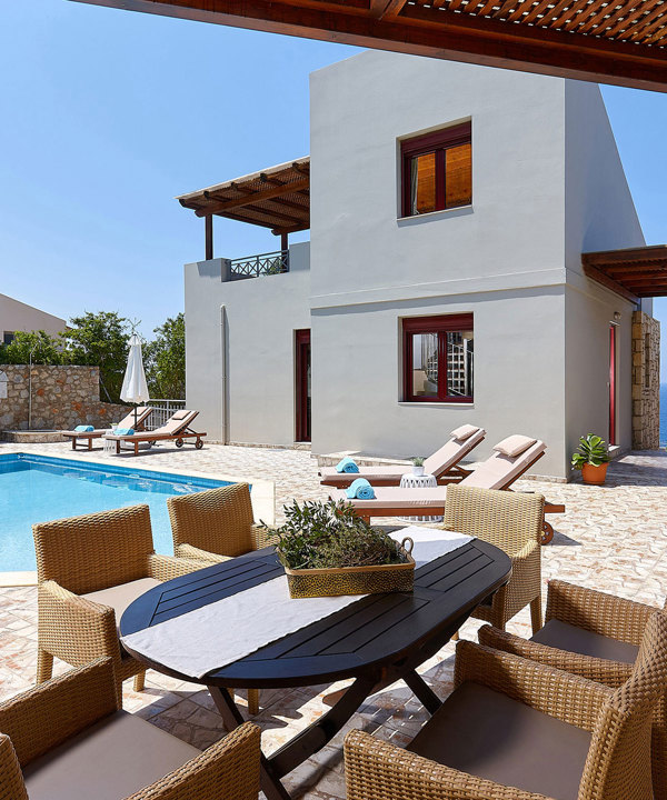 Okeanides Villas Crete Villa Dioni garden with dining area swimming pool