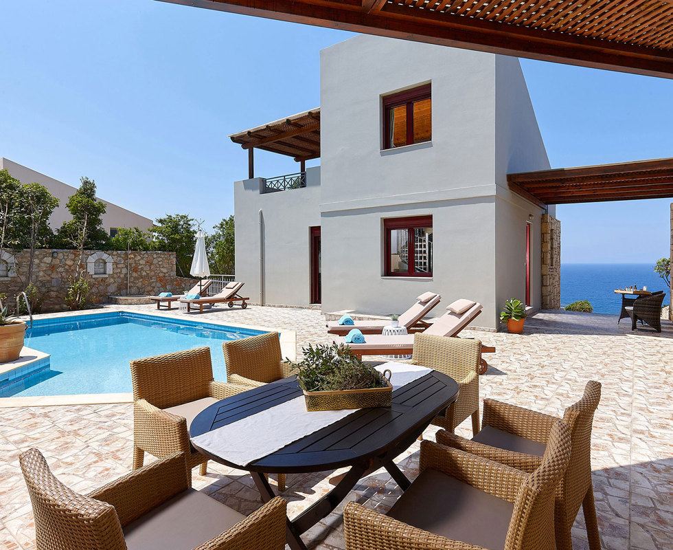 Okeanides Villas Crete Villa Dioni garden with dining area swimming pool