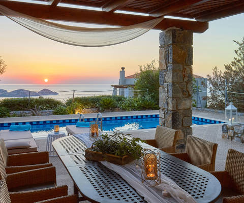 Okeanides Villas Crete Villa Kalypso garden with dining area swimming pool sea view