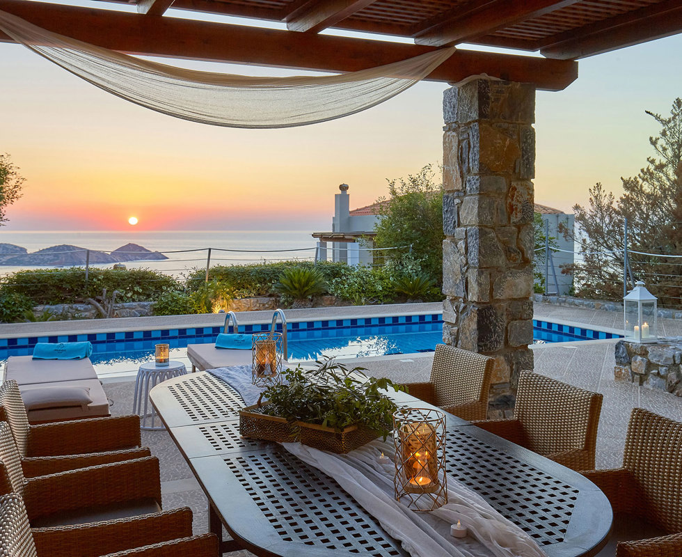 Okeanides Villas Crete Villa Kalypso garden with dining area swimming pool sea view